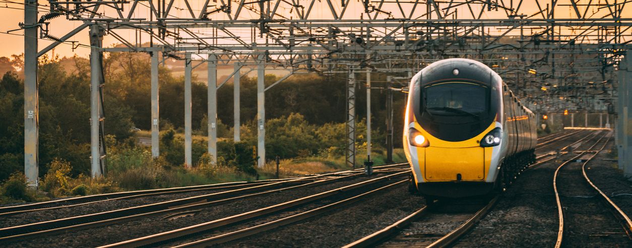 train on tracks with sunset